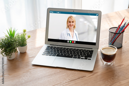 Doctor video call online by modish telemedicine software application for virtual meeting with patient photo
