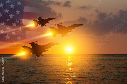 Air Force Day. Aircraft silhouettes on background of sunset on the sea with a transparent American flag.