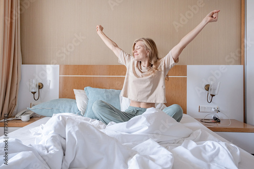 Bilde på lerret Woman stretching in bed after wake up