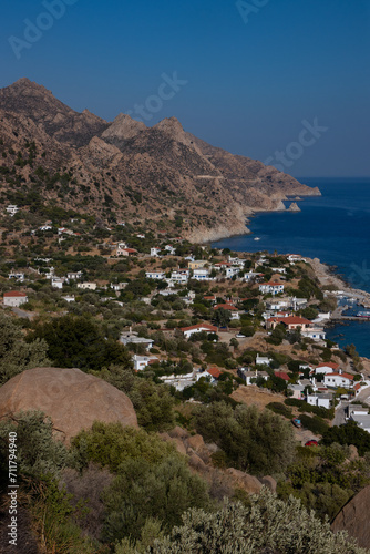 View to the picturesque fishing bvillage of Karkinahrig with wild rocky coast, Ikaria, Greece