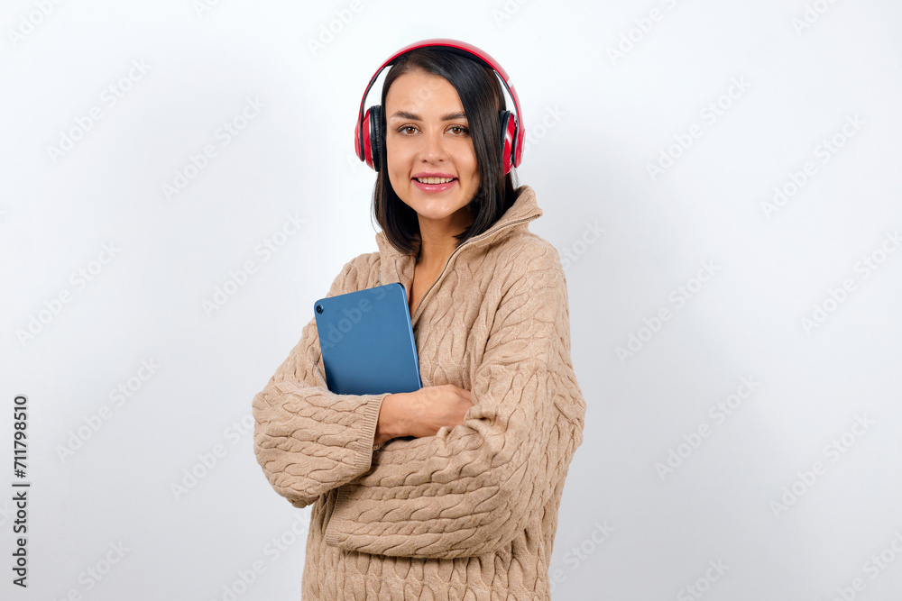 Lifestyle concept, woman in headphones with tablet in hands Lifestyle concept, woman in headphones with tablet in hands