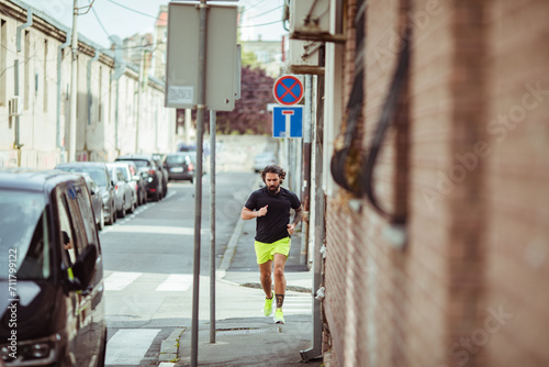 Man jogging in urban alley