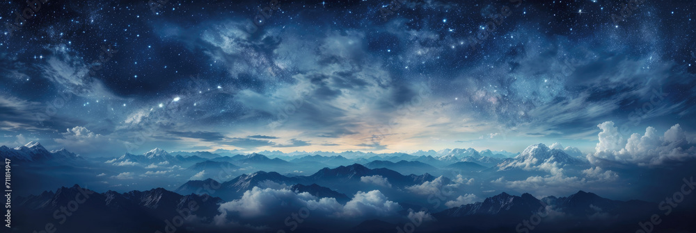 A panoramic view of a starry sky, with a mountain range below.
