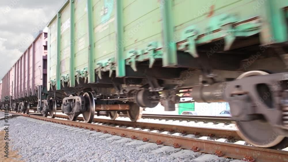 Wheels of fast moving freight train on railway at summer day. Wheels of fast moving freight train on railway at summer day.