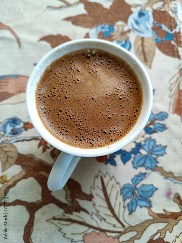 Full coffee mug ready to drink tasty coffee from the top view