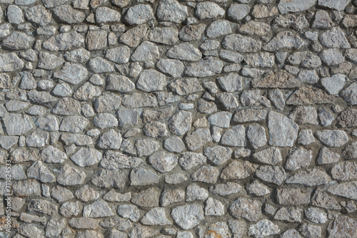 Background of stone wall texture photo. Close-up of stone wall.