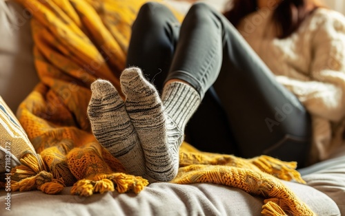 Person relaxing with feet up in cozy home environment. photo