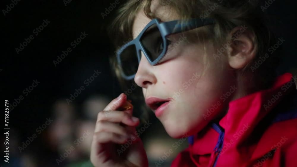 Little girl watch a movie in 3D glasses at the cinema. Little girl watch a movie in 3D glasses at the cinema.