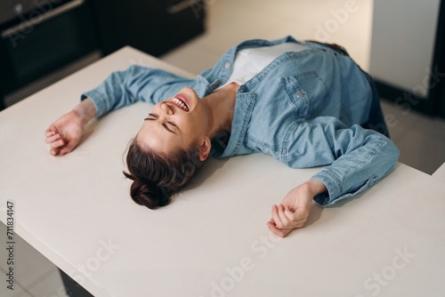 Serene Morning Beauty: Young Caucasian Woman Lying on White Bed, Enjoying Relaxation and Sound Sleep in Comfortable Bedroom