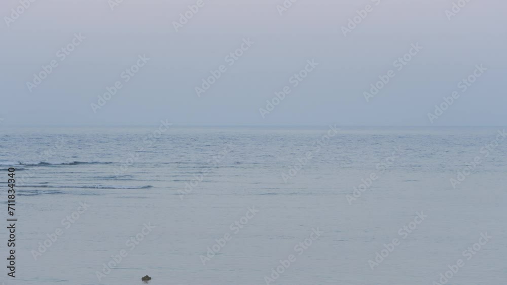 Calm sea in the evening after sunset, infinite ocean concept Calm sea in the evening after sunset, infinite ocean concept