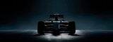 Silhouette of a Formula One car under dramatic lighting. 