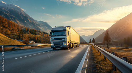 Modern white truck on highway with autumn trees and mountain backdrop, commercial transport, freight logistics, sunrise, road trip, scenic drive. photo