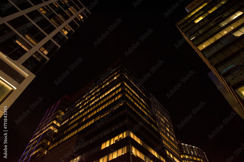 Glass office buildings of skyscrapers in Boston. View up. Night photo. USA. Boston