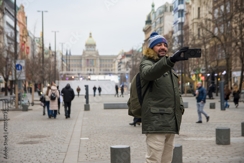 A tourist in Prague taking selfie