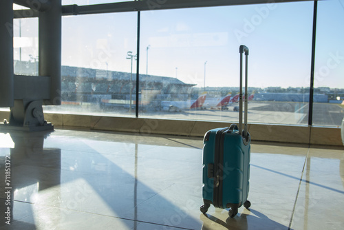 The suitcases in an empty airport hall, traveler cases in the departure airport terminal waiting for the area, vacation concept, blank space for text message or design