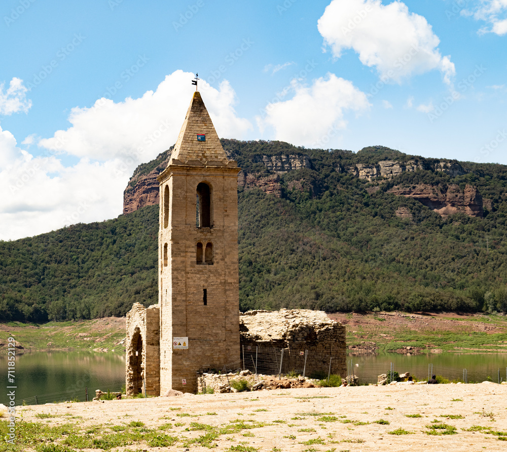 Church in Sau Swamp during the drought. Scarcity of water in Spain, environmental problems.
