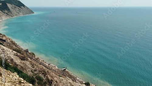 Panoramic view of the sea surface from the coast. Black Sea, Anapa, Krasnodar Territory, Russia. Sunset view of Bald Mountain near the village of Supseh. The beach has 800 steps. 4K Video photo