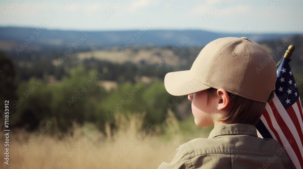 Child sitting near headstones with american flags
