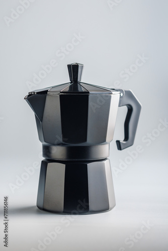 Bialetti moka pot. Coffee maker on gray background. photo