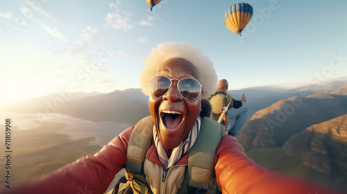senior woman flying down during skydiving jump aged skydiver floating in air with parachute freefall active old age photo
