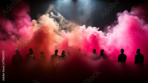 Group people on a background of colored smoke