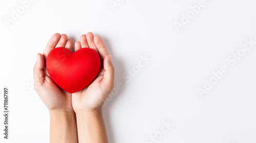 Soft Red Toy Heart in the Woman Hands on Light Background. Valentine Day Concept. Flat Lay Top View. Copy Space For Your Text.