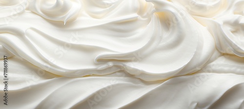 Close up of delicious white natural creamy vanilla yogurt top view on a plain background