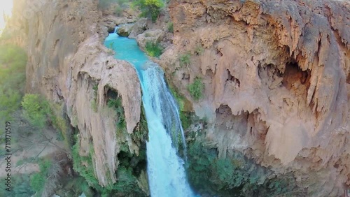 Havasu Falls on creek with small cave at autumn day