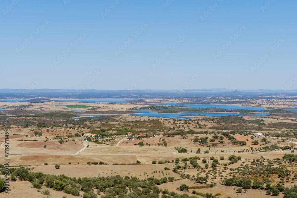 Alentejo landscape view form Monserate fort city village and Alqueva water reservoir on summer time