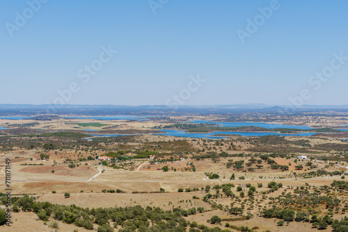 Alentejo landscape view form Monserate fort city village and Alqueva water reservoir on summer time