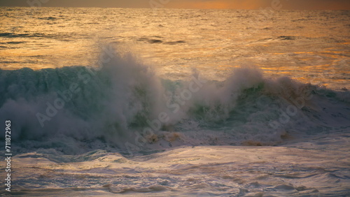 White ocean wave swelling rolling seashore close up. Powerful surf splashing