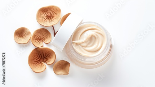 Top view flat lay composition of jar of skin care cream and reishi mushroom on a white background, skin care trend, cosmetic mushrooms, natural organic eco - friendly product. Mushrooms beauty product