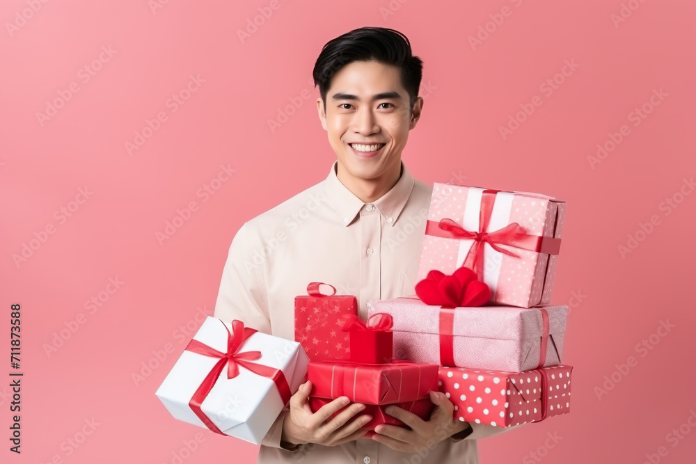 happy handsome asian man holds red and pink gift box, valentine's day happy handsome asian man holds red and pink gift box, valentine's day
