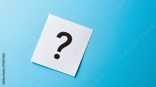 A single question mark centered on a white note against a blue background. Q and A Concept for website.