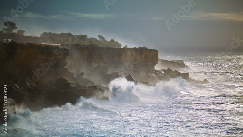 Storm ocean hitting rocky coastline. Powerful waves splashing making explosion