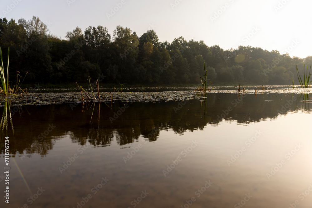 Obraz premium The river during the dawn in autumn , the waves on the river