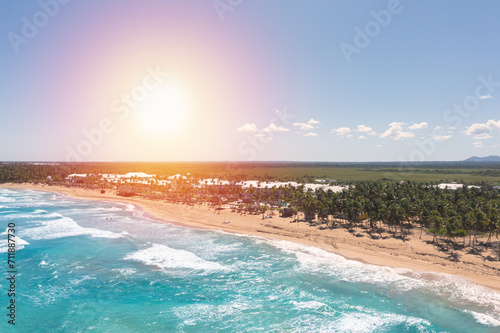 Fototapeta Naklejka Na Ścianę i Meble -  Wild tropical beach with palm trees and turquoise caribbean sea. Beautiful beachfront. Aerial view