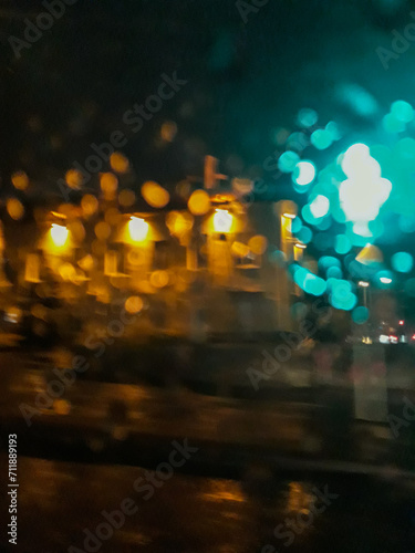 Abstract pictures of the architecture of Vilnius are made on a rainy evening in the car at speed. Raindrops and light play