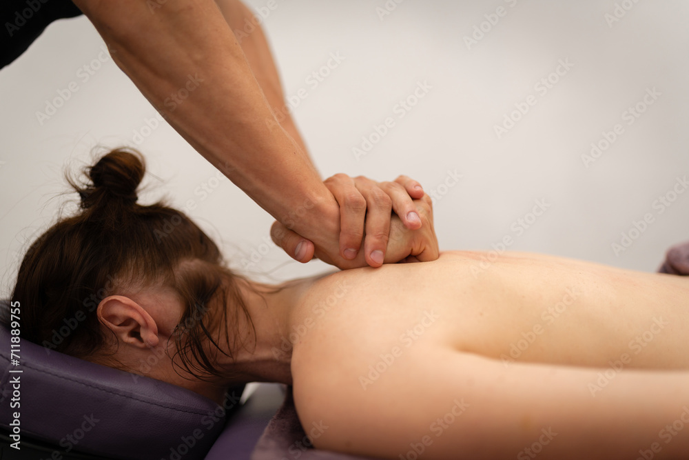 Fototapeta premium Concentrated Back Massage by Professional Masseuse