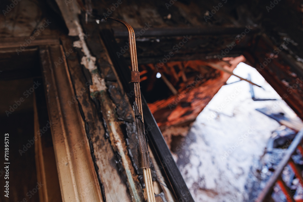 Fire in apartment due to faulty wiring. Electrical short circuit. Failure caused by burning wire and rosettes socket plug in house Fire in apartment due to faulty wiring. Electrical short circuit. Failure caused by burning wire and rosettes socket plug in house