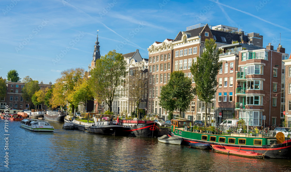Amsterdam, Netherland October 10 2023- Channel in Amsterdam Netherlands houses river Amstel landmark old European city autumn landscape.