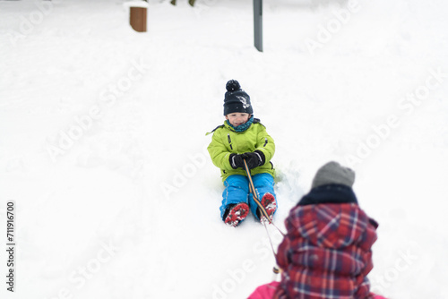 Kids Having Fun on Sledding Playing in Snow