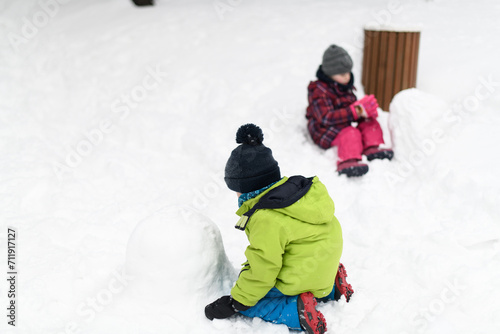 Children Run and Play in the Winter Forest