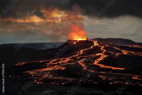 Lava spurting out of crater and reddish illuminated smoke cloud, lava flows, erupting volcano, Fagradalsfjall table volcano, Krysuvik volcano system, Reykjanes Peninsula, Iceland, Europe