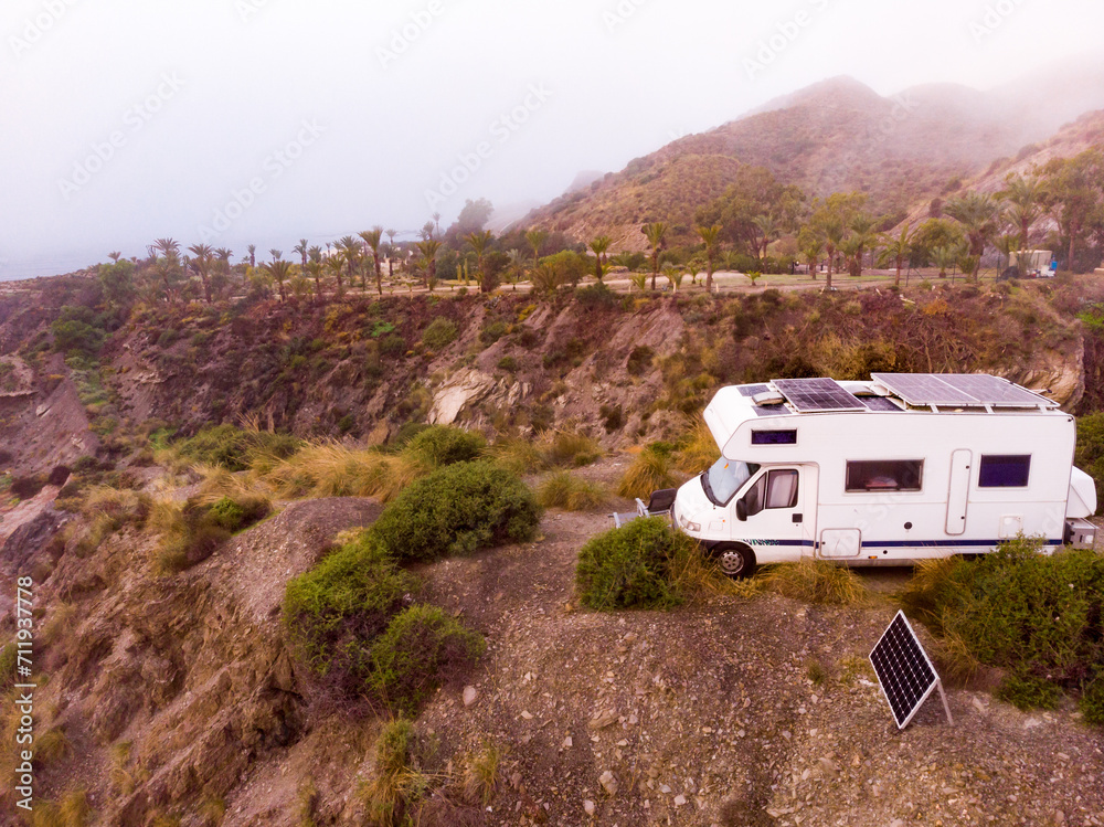 Caravan with solar panels on roof camp on coast, Spain. Aerial view. Caravan with solar panels on roof camp on coast, Spain. Aerial view.
