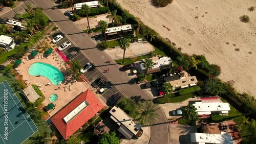 Aerial Panning Shot Of Mobile Homes Parked In Tranquil Park On Sunny Day - Palm Springs, California