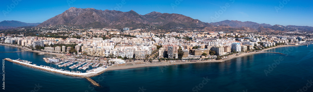 Aerial drone perspective of beautiful over luxury Puerto Banus Bay in Marbella, Costa del Sol. Spain - obrazy, fototapety, plakaty 