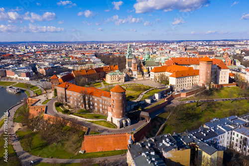 Aerial view of Wawel Hill with fortified Castle complex and belfry of Cathedral of Saints Stanislaus and Wenceslaus on sunny spring day, Krakow, Poland.. photo