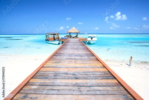 Jetty leading to tropical sea, Indian ocean, Maldives photo
