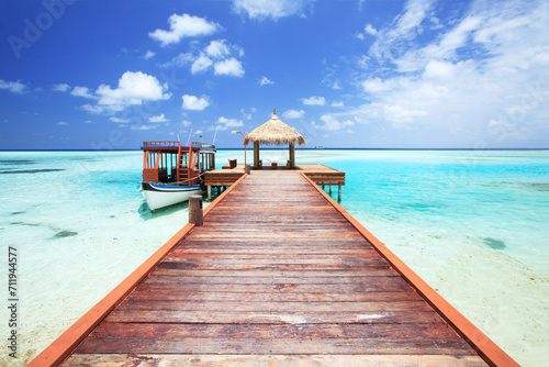 Pier to tropical sea in the Maldives, Indian ocean photo